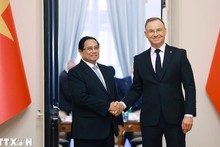 Премьер-министр Фам Минь Тьинь и Президент Польши Анджей Дуда. Фото: ВИА