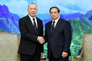 Премьер-министр Фам Минь Тьинь и Вице-премьер Малайзии Фадилла Юсоф. Фото: Чан Хай