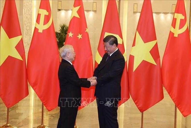 Генеральный секретарь ЦК КПВ Нгуен Фу Чонг (слева) и Генеральный секретарь ЦК КПК, Председатель Китая Си Цзиньпин. Фото: VNA