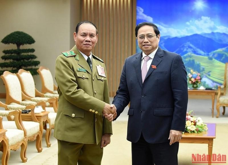 Премьер-министр Фам Минь Тьинь и генерал армии Вилай Лакхамфонг, Вице-премьер, Министр общественной безопасности Лаоса. Фото: Чан Хай