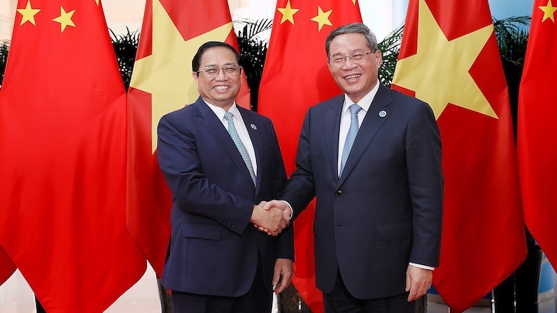 Премьер-министр Фам Минь Тьинь и Премьер Госсовета Китая Ли Цян. Фото: ВИА