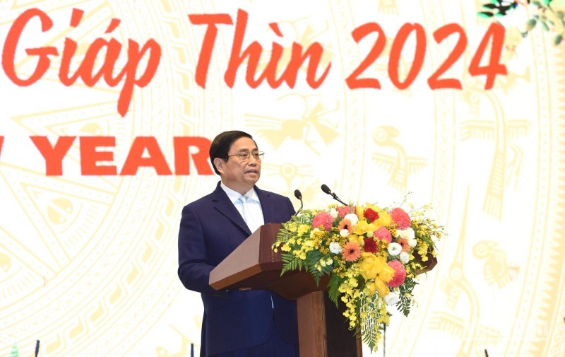 Премьер-министр Фам Минь Тьинь выступает на приеме. Фото: Чан Хай