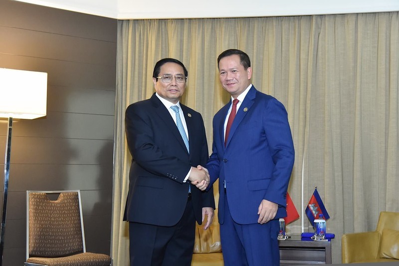 Премьер-министр Фам Минь Тьинь и Премьер-министр Камбоджи Хун Манет. Фото: Туан Ань