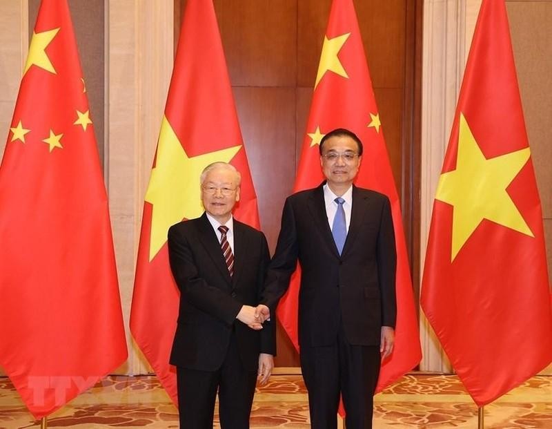 Генеральный секретарь ЦК КПВ Нгуен Фу Чонг на встрече с Премьером Госсовета Китая Ли Кэцяном. Фото: VNA