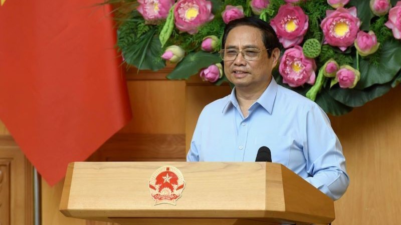 Премьер-министр Фам Минь Тьинь выступил на приеме. Фото: Чан Хай