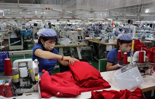 Рабочие в индустриальныом парке Бакдонгфу (провинция Биньфыок). Фото: ВИА
