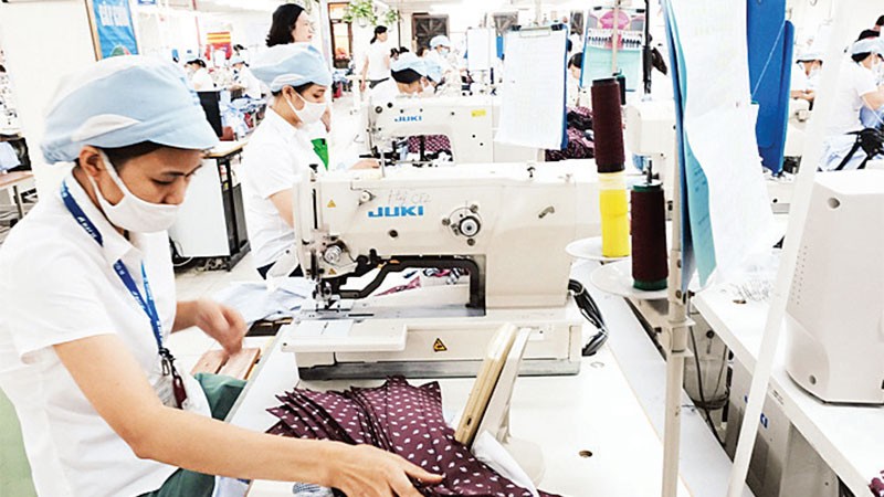Производственная деятельность в швейной корпорации №10. Фото: Кхак Киен