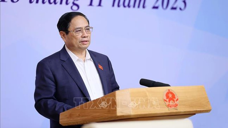 Премьер-министр Фам Минь Тьинь выступает на конференции. Фото: ВИА