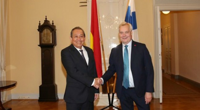 Постоянный Вице-премьер Вьетнама Чыонг Хоа Бинь (слева) и Премьер-министр Финляндии Антти Ринне. Фото: VGP