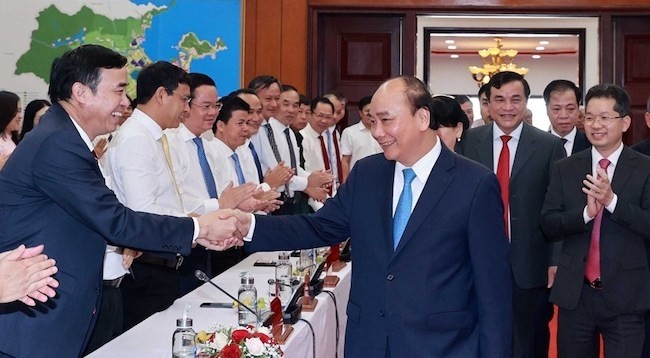 Президент Вьетнама Нгуен Суан Фук и делегаты. Фото: VNA