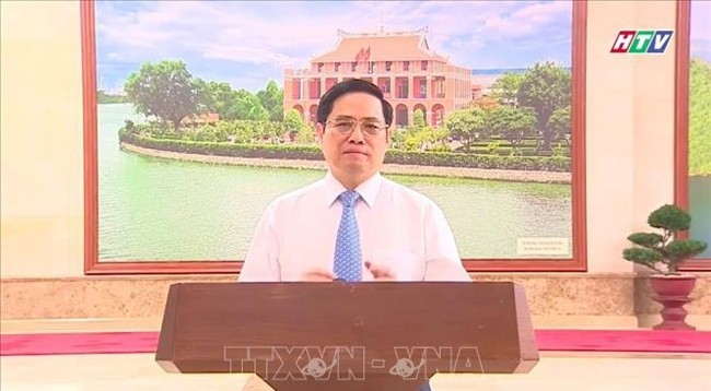 Премьер-министр Фам Минь Тьинь выступает с речью. Фото: VNA