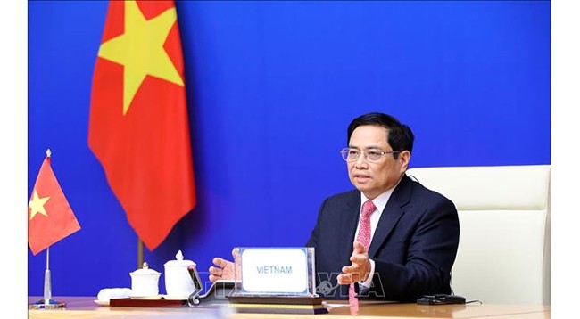 Премьер-министр Фам Минь Тьинь на саммите. Фото: VNA