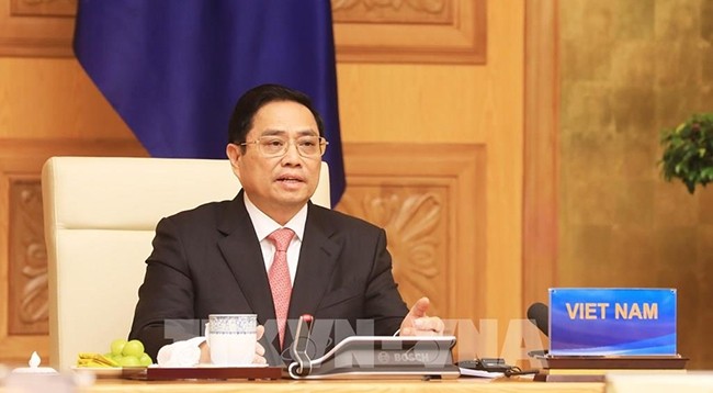 Премьер-министр Фам Минь Тьинь выступает на саммите. Фото: VNA