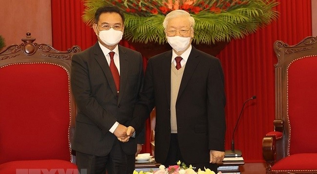 Генеральный секретарь ЦК КПВ Нгуен Фу Чонг (справа) и Председатель НА Лаоса Сайсомфон Фомвихан. Фото: VNA