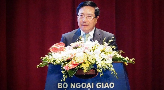 Постоянный вице-премьер Вьетнама Фам Бинь Минь выступает с речью. Фото: VNA