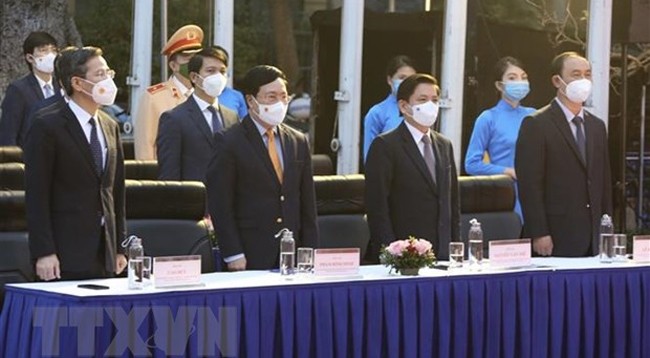 Постоянный Вице-премьер Фам Бинь Минь и делегаты на мероприятии. Фото: VNA