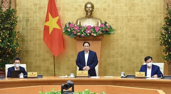 Премьер-министр Фам Минь Тьинь выступает на заседании. Фото:  Чан Хай