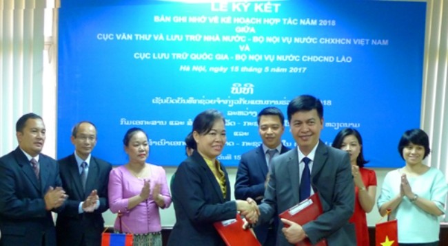 Церемония подписания Меморандума о планах на 2018 год. Фото: hanoimoi.com.vn