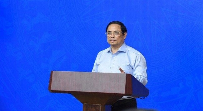 Премьер-министр Вьетнама Фам Минь Тьинь выступает с речью. Фото: Чан Хай 